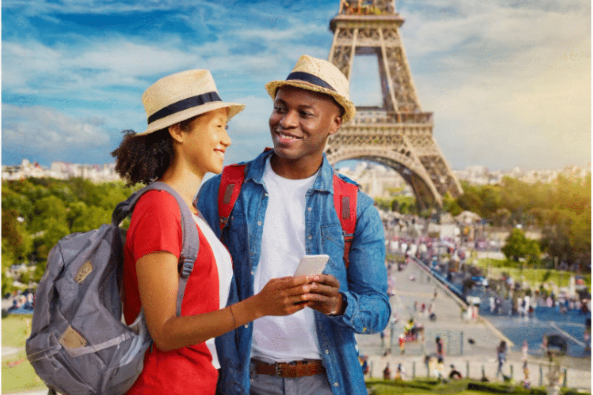 A Happy Couple Conducts Landmark Search on Smart Phone in Paris, France