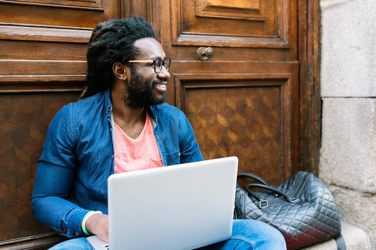 A relaxed customer reconnects with their laptop, symbolizing re-engagement