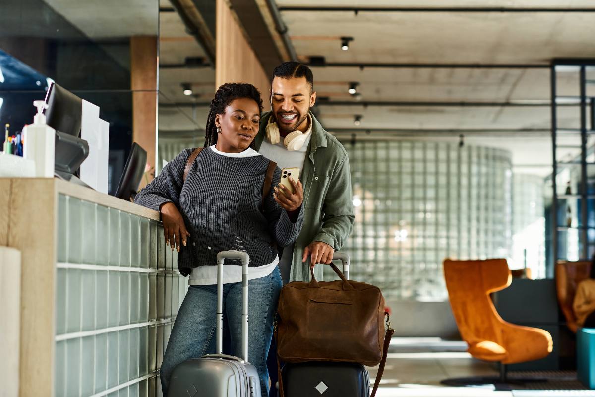 Guests at a modern reception desk highlight the potential of co-branding opportunities in travel and hospitality